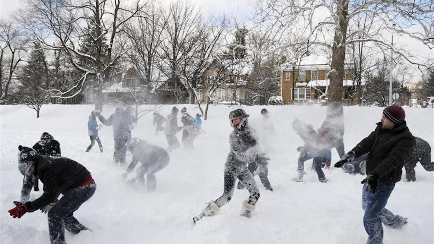 Student battle in a snow ball fight Wednesday in Dunn Meadow. IU canceled classes Wednesday due to snow, and Monroe County declared a state of emergency.
