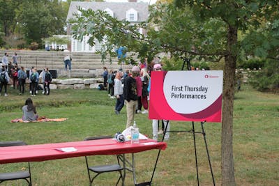 Students gather near the President’s House Oct. 1 for First Thursdays. The monthly First Thursdays celebrations are still happening despite the COVID-19 pandemic, but are now more spread out to comply with social distancing guidelines. 