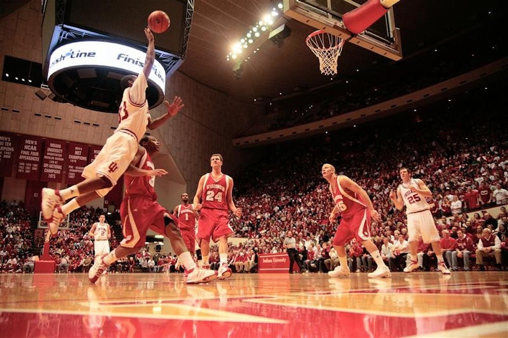Junior guard Devan Dumes soars toward the goal during the first half of the Hoosiers game against Wisconsin Thursday night at Assembly Hall. 