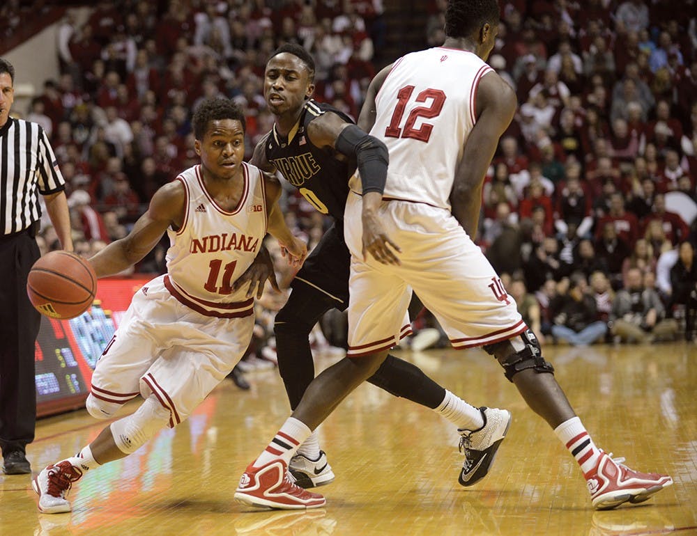 Junior guard Kevin "Yogi" Ferrell goes around a pick set by junior Hanner Mosquera-Perea on Thursday at Assembly Hall.