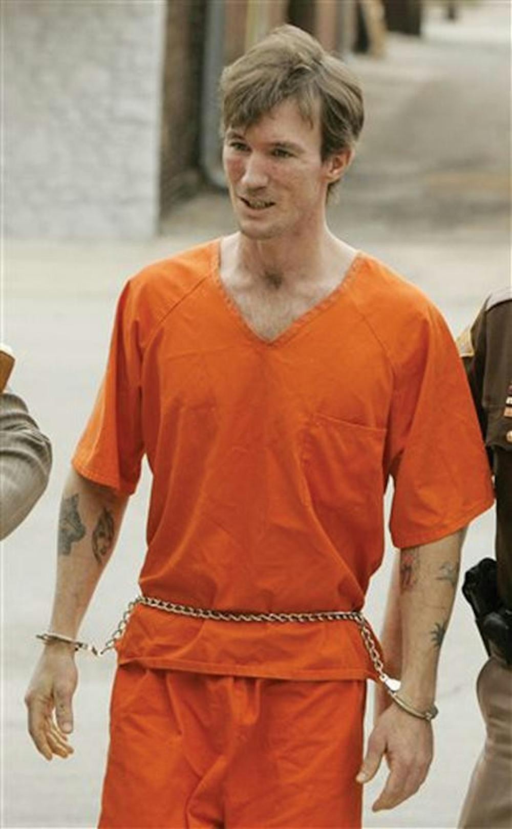John R. Myers II of Ellettsville, Ind., enters the Morgan County Courthouse in Martinsville, Ind., Tuesday,  April 11, 2006.  A judge entered a not guilty plea Tuesday for Myers who was charged with the 2000 slaying of Bloomington cyclist Jill Behrman.   