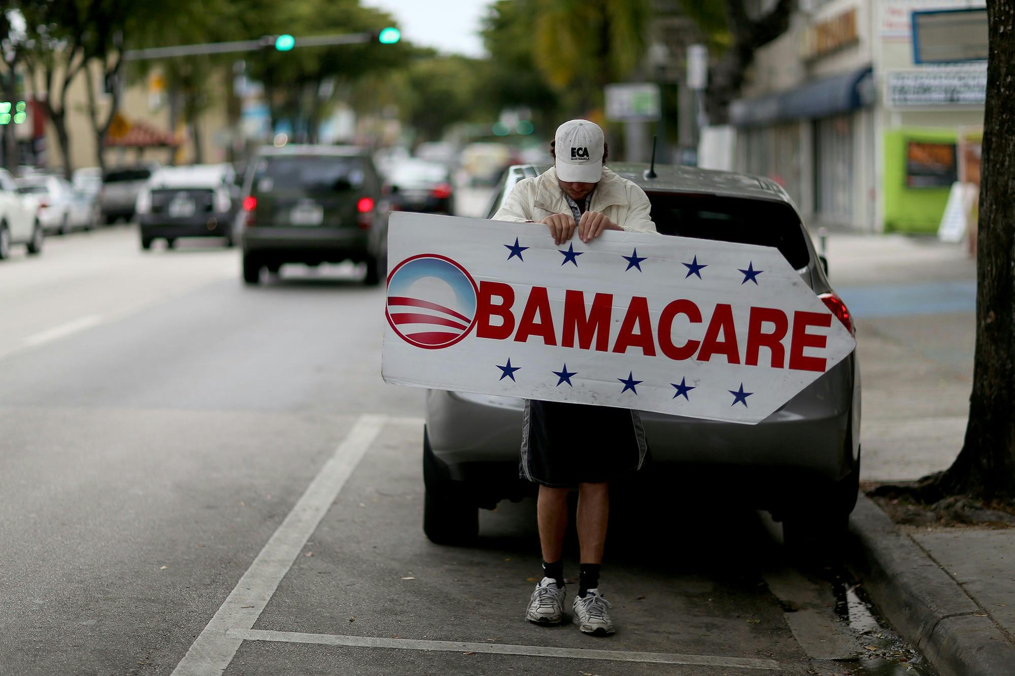 A Miami insurance company advertises Feb. 5, 2015, that people can apply for the Affordable Care Act, also known as Obamacare. 