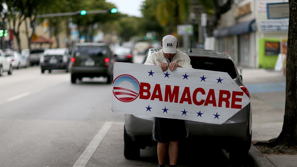 A Miami insurance company advertises Feb. 5, 2015, that people can apply for the Affordable Care Act, also known as Obamacare. 
