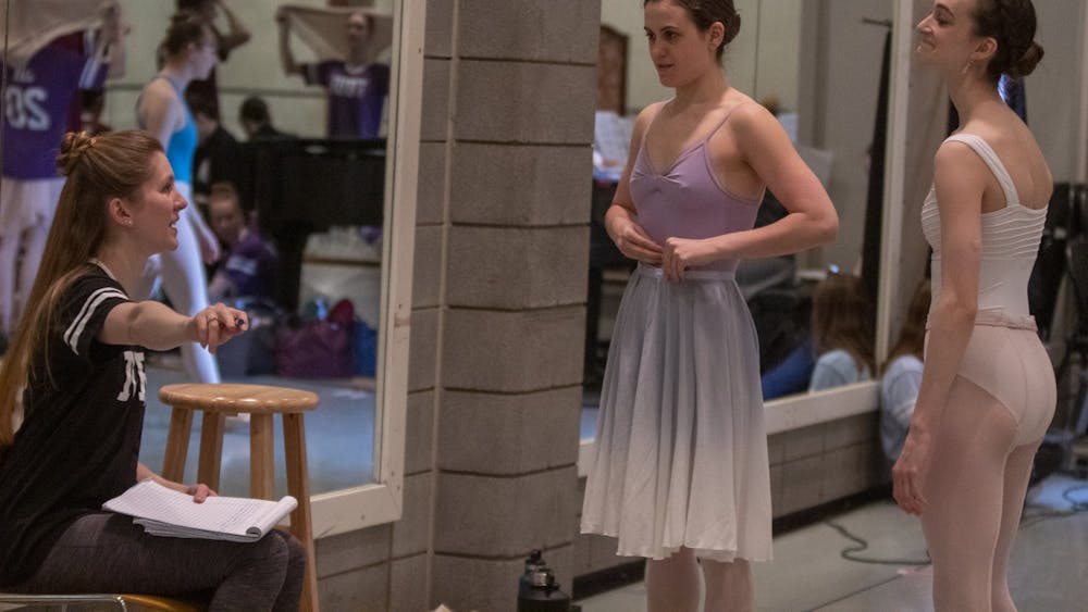 Professor Carla Körbes gives corrections to senior Haley Baker and junior Lily Bines on March 13 in the Musical Arts Center. Baker and Bines were both cast as Cinderella in the now-canceled spring ballet. 