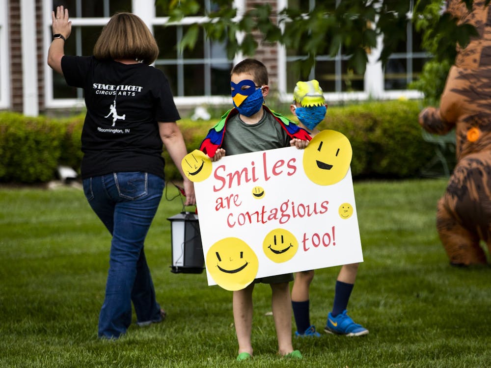 A boy holds a sign May 22 at Bell Trace. Stage Flight Circus Arts came to Bell Trace to perform for those living there. 