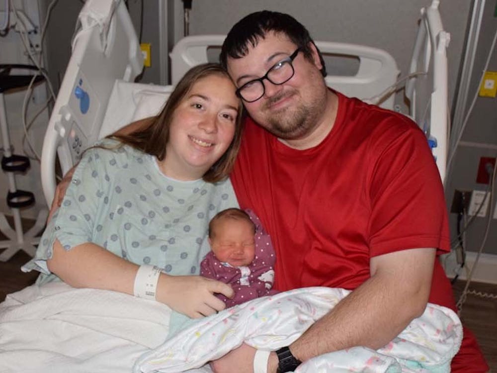 Christina and Andrew Ward hold their daughter Annalee Gracelynn Ward on Jan. 1, 2023. Annalee was the first baby of 2023 to be born at IU Health Bloomington.