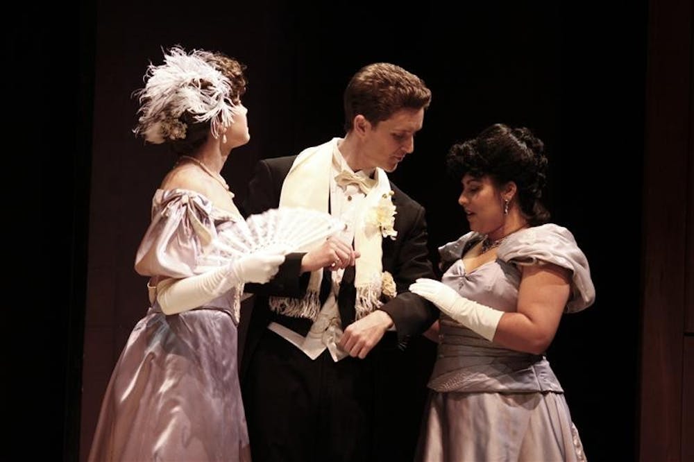 Juniors Isobel Dieppa and Gina DiSerio perform with graduate student Matthew Buffalo in the dress rehersal for 'An Ideal Husband" Monday evening at the Ruth N. Hall Theatre. 