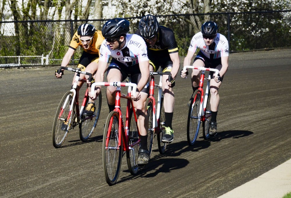 Biker from Beta Cycling watches his competitor from the Black Key on his right side, during the Little 500 Miss-N-Out at the Louis Armstrong on Saturday.