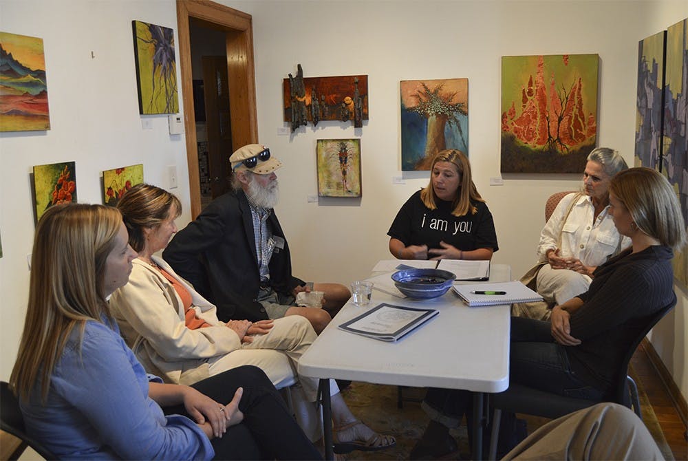 Carmen Levasseur leads a session called When Art Heals for Suicide Prevention Week at The Venue on Tuesday night.She explains the process of how art heals the mind and demonstrates with hands on projects, including filling a circle with anything that comes to mind and filling in family crest with positive attributes about one's self.
