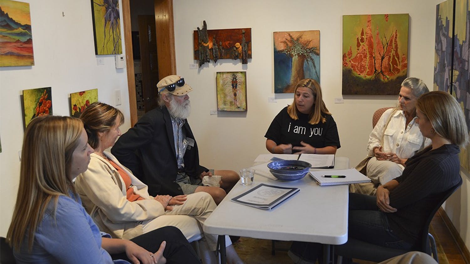Carmen Levasseur leads a session called When Art Heals for Suicide Prevention Week at The Venue on Tuesday night.She explains the process of how art heals the mind and demonstrates with hands on projects, including filling a circle with anything that comes to mind and filling in family crest with positive attributes about one's self.