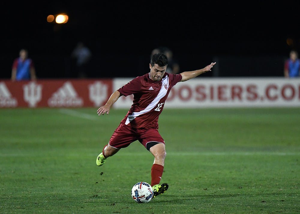 Junior midfielder Austin Panchot kicks the ball against Evansville on Tuesday evening at Bill Armstrong Stadium. IU will look to continue its undefeated start on the road this Saturday night at Penn State.&nbsp;