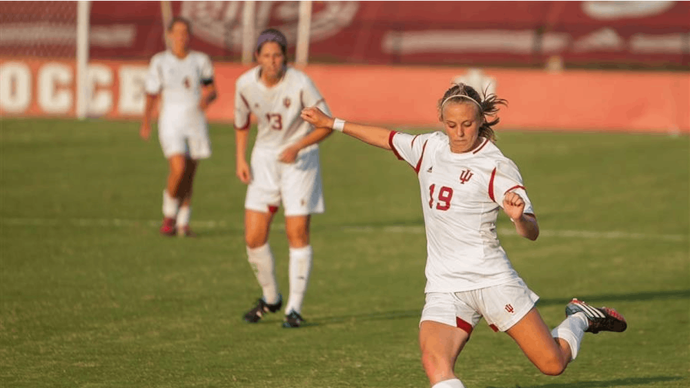 Senior midfielder Becca Zambon makes a pass as teammates look on during Friday's game at Bill Armstrong Stadium. The Hoosiers defeated Eastern Michigan 1-0.