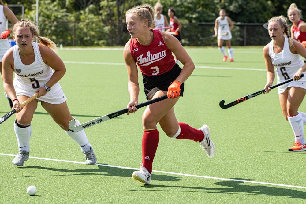 <p>Freshman Kayla Kiwak runs with the ball during a match against Bellarmine University on Sept. 6, 2021, at the IU Field Hockey Complex. Indiana lost to Iowa on Friday and beat the University of Richmond on Sept. 19, 2021.</p>