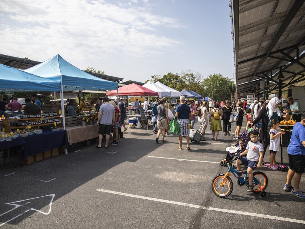 A crowd of people visit stalls Sept. 11, 2021, at the Bloomington Community Farmers&#x27; Market. The COVID-19 pandemic caused many farmers to sell less to restaurants and more directly to consumers.