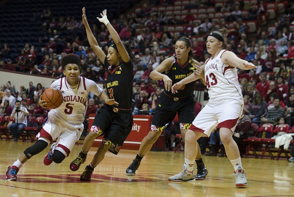 Sophomore guard Larryn Brooks attempts to drive past Maryland's Brene Moseley during IU's game against the Terrapins in Assembly Hall on Sunday.