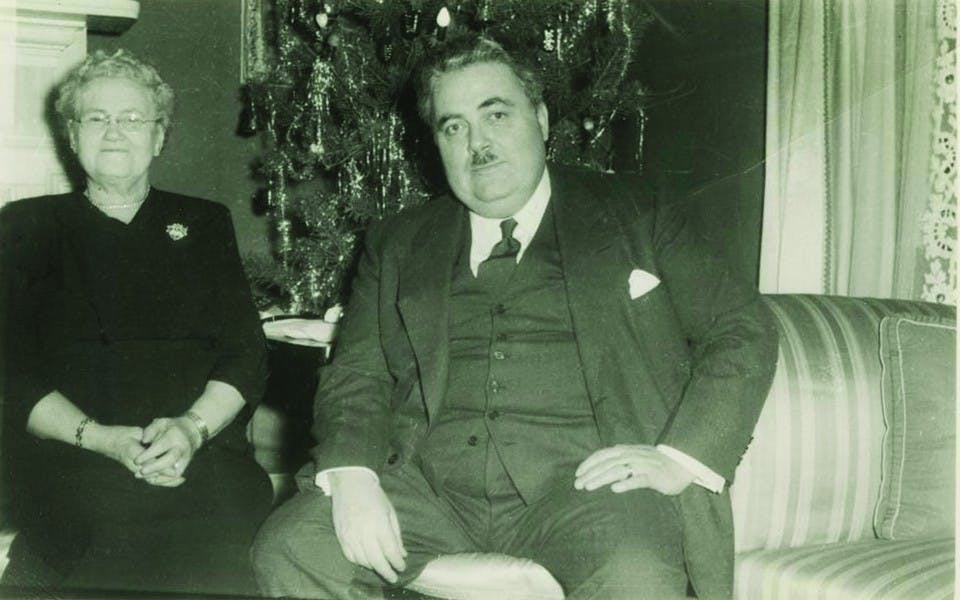 Herman B Wells with his mother, Anna Bernice Harting Wells, in the front room of Woodburn House about 1950.  Wells served IU in many capacities including as the Univeristy's 11th president and long-time chancellor.  