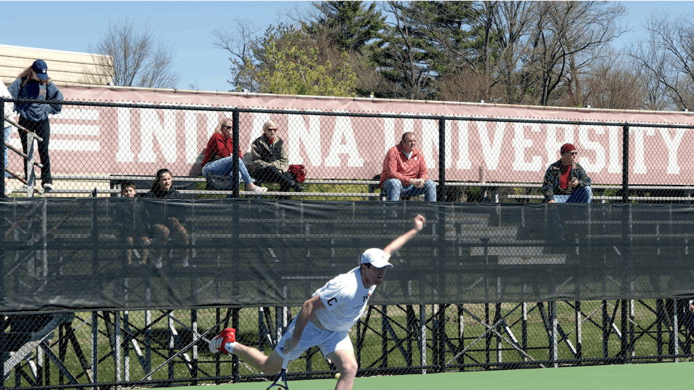 Senior Patrick Fletchall mid-return April 2, 2023, at the IU Tennis Courts. Indiana hosts the Big Ten Tournament and will face Penn State on Thursday.