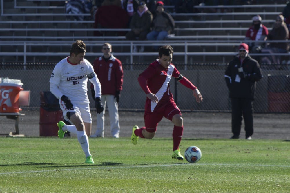 Senior Matt Foldesy tries to get past a UConn defender in the first half of play on Sunday at Bill Armstrong Stadium. The Hoosiers won 1-0. 