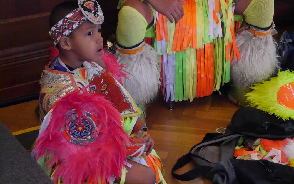 Native American Dancer Lucas Cleveland prepares for the Intertribal Dance performance during the 5th Annunal Traditional Powwow on Sartuday afternoon in Alumni Hall. IU's First Nations Educational and Culture Center sponsored the event.