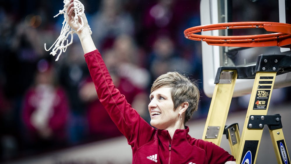 Head coach Teri Moren celebrates after cutting the net Feb. 19, 2023 at Simon Skjodt Assembly Hall in Bloomington, Indiana. Indiana Athletics announced Friday that Moren's contract has been extended through the 2028-2029 season. 