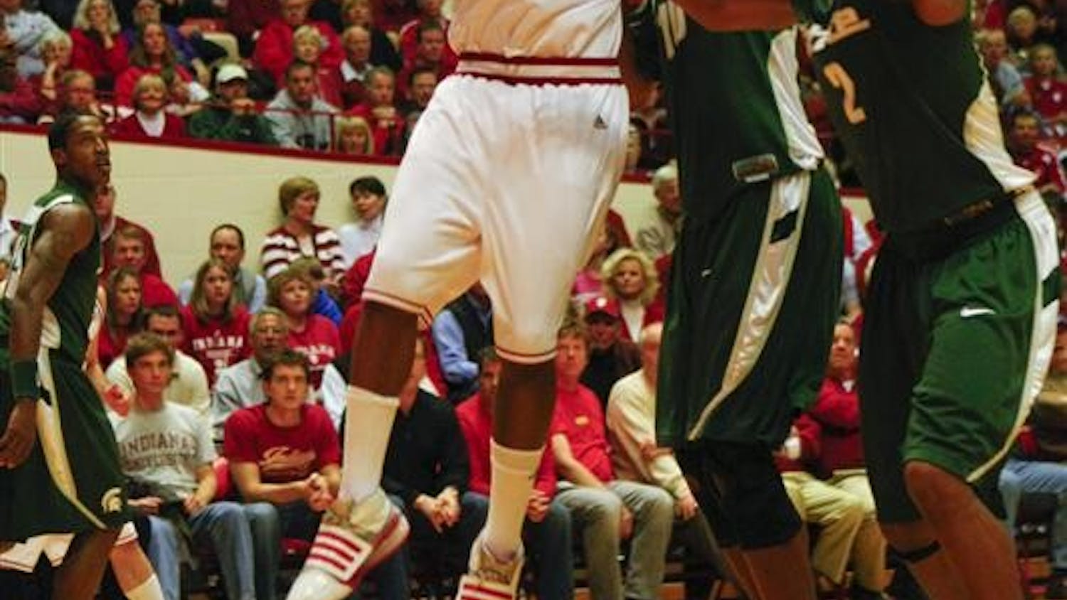 Freshman Guard/Forward Malik Story goes for a basket against a Michigan State defender Tuesday evening at Assembly Hall. The Hoosiers lost to Michigan State with a final score of 59-64.