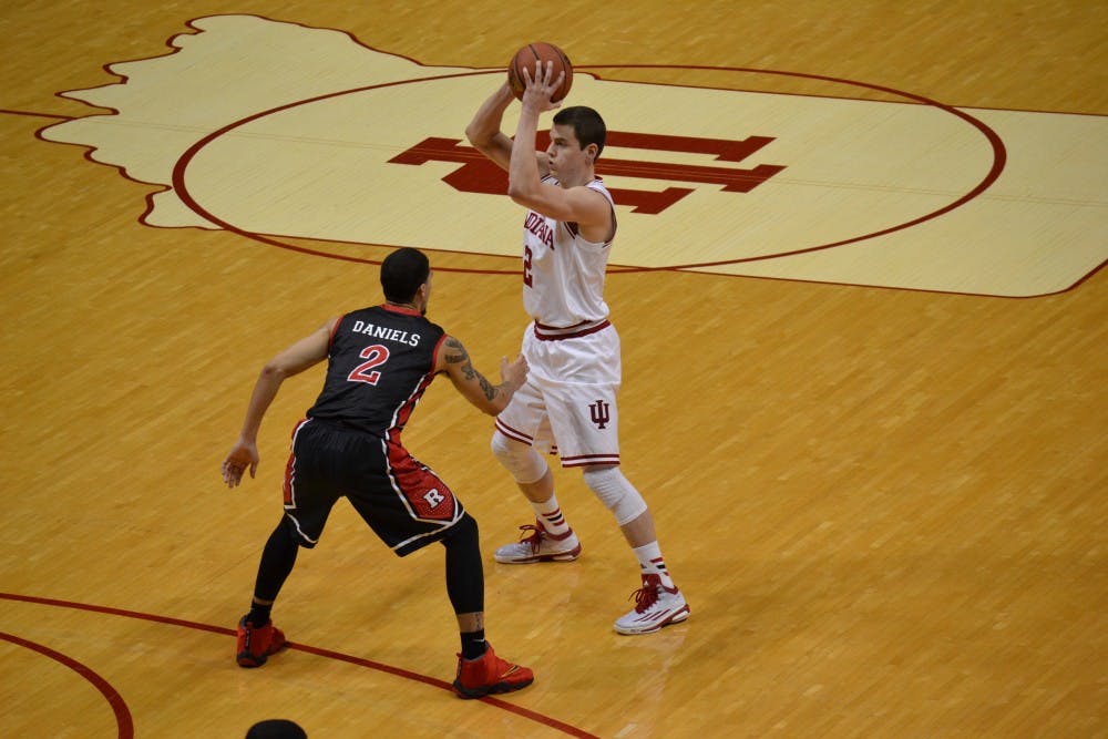 <p>Junior guard Nick Zeisloft looks to pass the ball during the game against Rutgers on Saturday at Assembly Hall.</p>