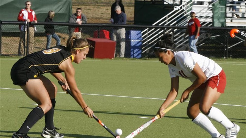 Then-junior back Brenna Moeljadi takes the ball from Iowa during an overtime game on Oct. 15, 2010 at the IU Field Hockey Field. 