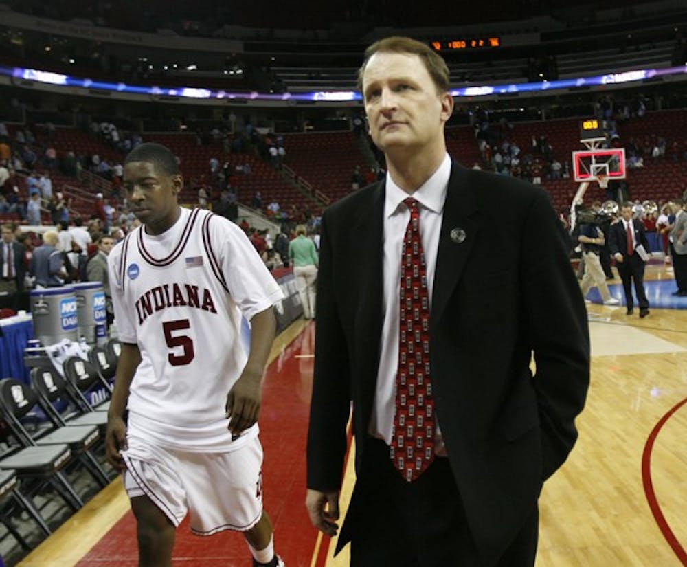 Jacob Kriese IDS
IU's head basketball coach Dan Dakich and freshman guard Jordan Crawford leave the RBC Center court after the Hoosiers fell to Arkansas 86-72 in the first round of the NCAA tournament.