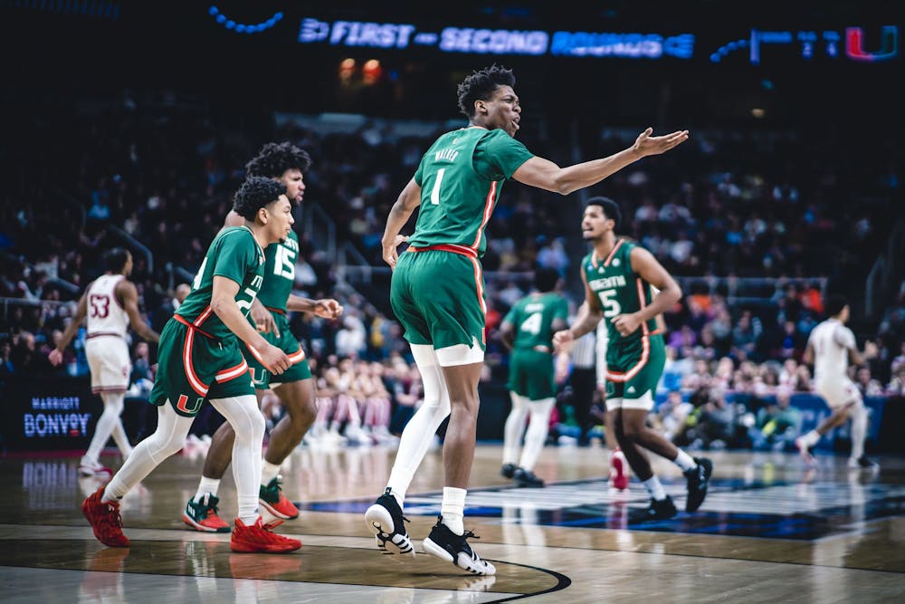 <p>Anthony Walker celebrates after a 6-0 Miami run in the first half March 19, 2023, at MVP Arena in Albany, New York. Walker transferred to Indiana on Saturday.</p>