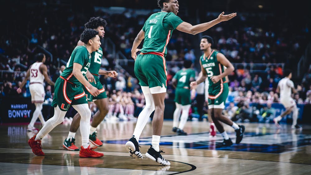 Anthony Walker celebrates after a 6-0 Miami run in the first half March 19, 2023, at MVP Arena in Albany, New York. Walker transferred to Indiana on Saturday.