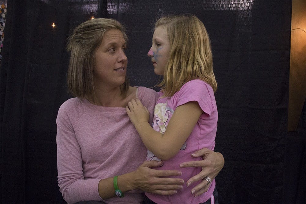 January Bowen and daughter Mara, 6, talk about Mara what activity Mara is going to do next during the IU Dance Marathon on Saturday. Mara went to Riley Children's Hospital when she got E. Coli when she was two years old and has been coming to IUDM for the last four years.