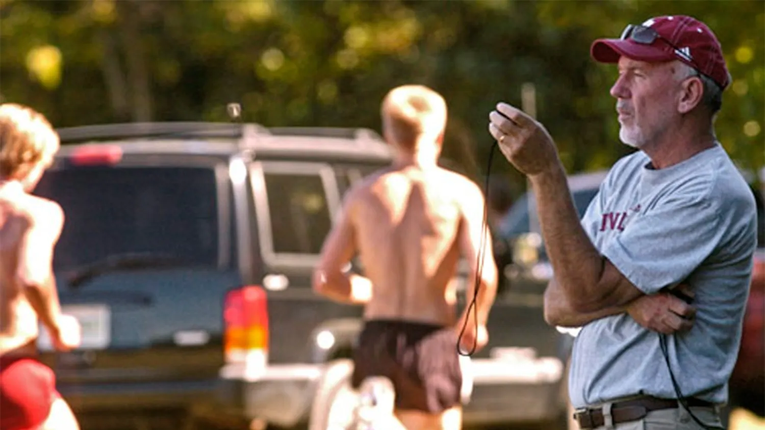Director and head coach Ron Helmer times members of the IU track team during practice September 7, 2007 at the IU Cross Country Course.