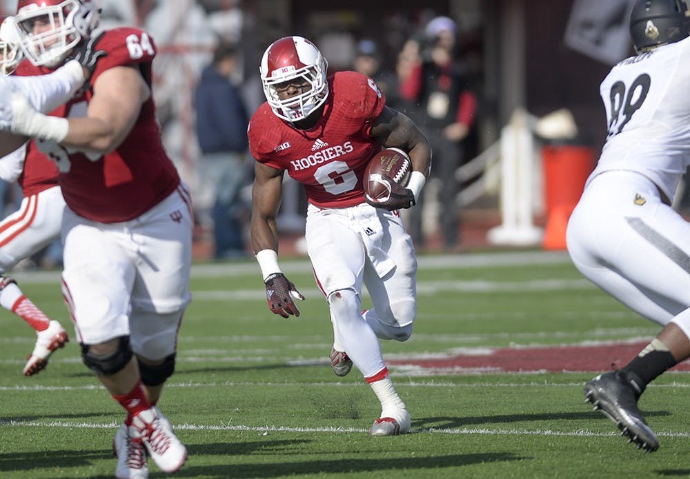 Junior running back Tevin Coleman runs the ball during IU's game against Purdue on Nov. 29, 2014 at Memorial Stadium. Coleman surpassed 2,000 yards rushing on the season during the Hoosiers' final game of the year.
