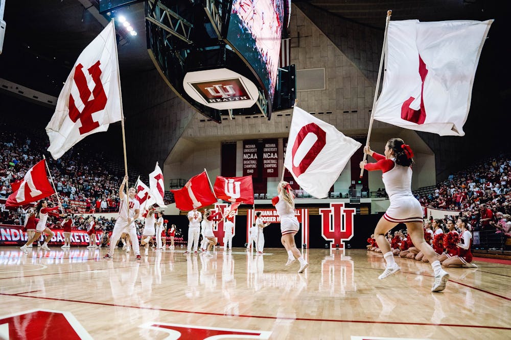 <p>Indiana cheerleaders pump up the crowd before Hoosier Hysteria on Oct. 2, 2021, at Simon Skjodt Assembly Hall.</p>