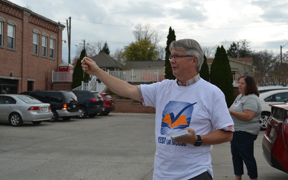 Mayor John Hamilton campaigns for the referendum outside Election Central on Wednesday night.