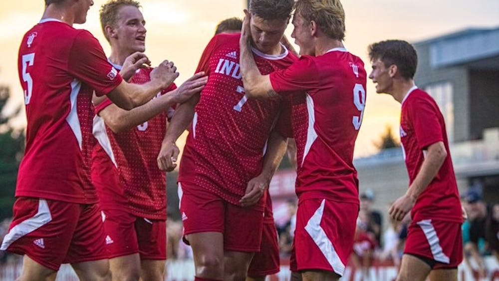 Teammates of Junior Victor Bezerra celebrate after he scores a goal against the University of Louisville Aug. 21 at Bill Armstrong Stadium. IU finished the preseason with a 2-0-1 record after beating Louisville 5-4.
