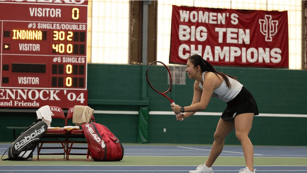 Indiana junior Xiaowei &quot;Rose&quot; Hu prepares to poach the ball after her partner&#x27;s serve. Indiana women&#x27;s tennis split its Big Ten road trip over the weekend.