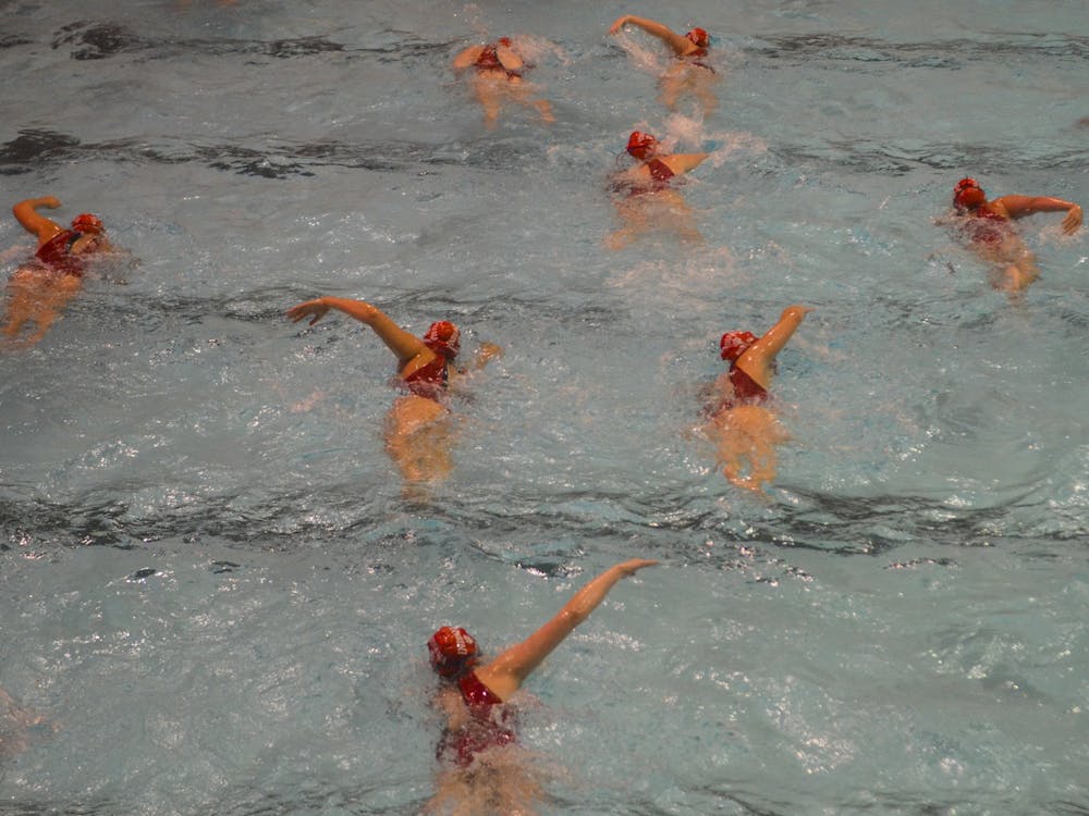 The IU women&#x27;s water polo team warms up March 7, 2020, in the Counsiman-Billingsley Aquatics Center. 
