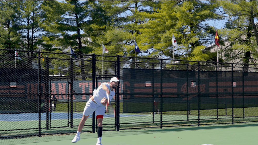 Senior Luka Vukovic serves in a singles match April 2, 2023, at the IU Tennis Courts. Indiana men&#x27;s tennis fell to Penn State and Ohio State over the weekend.