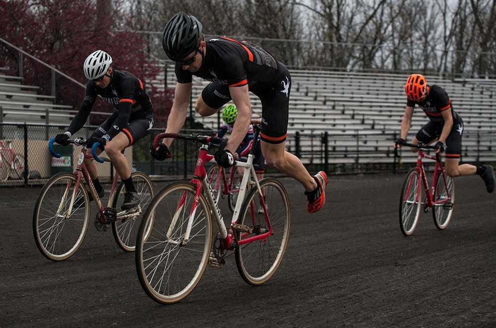 Grey Goat riders jump on their bikes at the beginning of Team Pursuit on Sunday at Bill Armstrong Stadium. Grey Goat placed fifth with a time of 9:45.61.