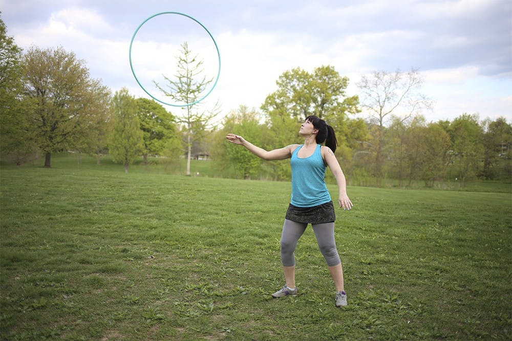 Clara Kallner does a hula hoop routine on Wednesday evening in Bryan Park. 