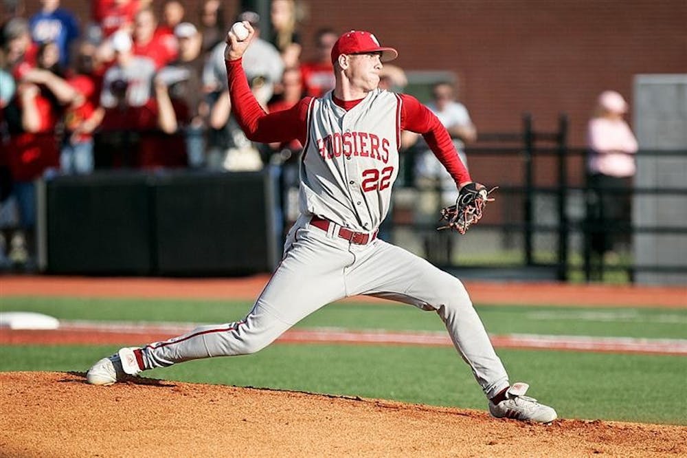 Junior Eric Arnett delivers a pitch during the Hoosiers 8-2 loss against Louisville Friday evening at Patterson Field. Collegiate Baseball Newspaper announced its All-American list Friday naming Arnett as a second-team All-American.