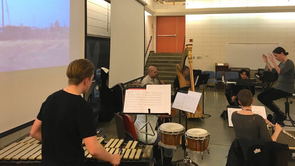 Students practice during a rehearsal of Double Exposure, a program that filmmaking students and music students cooperate last Thursday. IU Cinema presents a program of student work with a live ensemble and premiere presentation. 