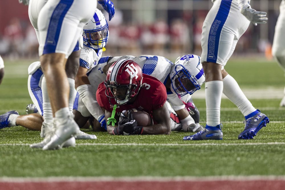 <p>Redshirt freshman wide receiver Omar Cooper Jr. is tackled on Sept. 8, 2023, at Memorial Stadium in Bloomington, Indiana. Indiana defeated Indiana State 41-7 on Friday.</p>