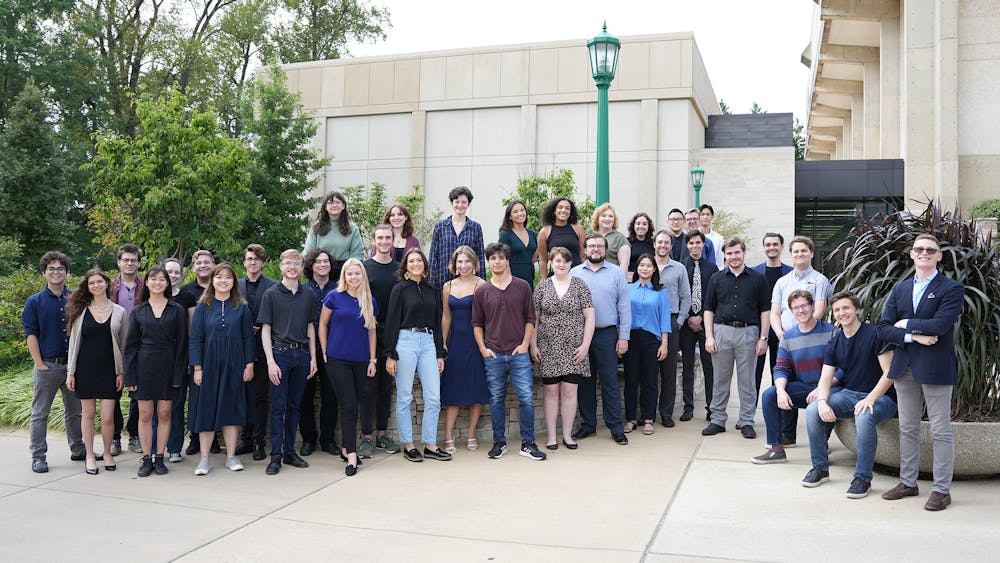 Members of IU&#x27;s vocal ensemble group, NOTUS, are seen standing outside for a group photo. NOTUS is the only university-based group in the United States that exclusively studies and performs choral arrangements written after 1900.