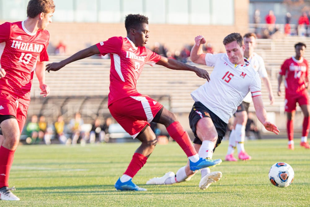 Sophomore Forward Herbert Endeley fights for the ball against Maryland on April 14 in Bill Armstrong Stadium. IU defeated the University of Pittsburgh 1-0 Friday to advance to the NCAA Championship.