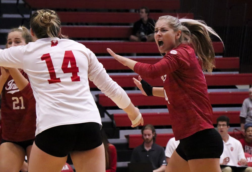 <p>IU junior Bayli Lebo and her teammates celebrate a point Sept. 6 at Wilkinson Hall against Oregon State University. IU will head to Lexington, Kentucky, this weekend to play three road matches for the first time this season.</p>