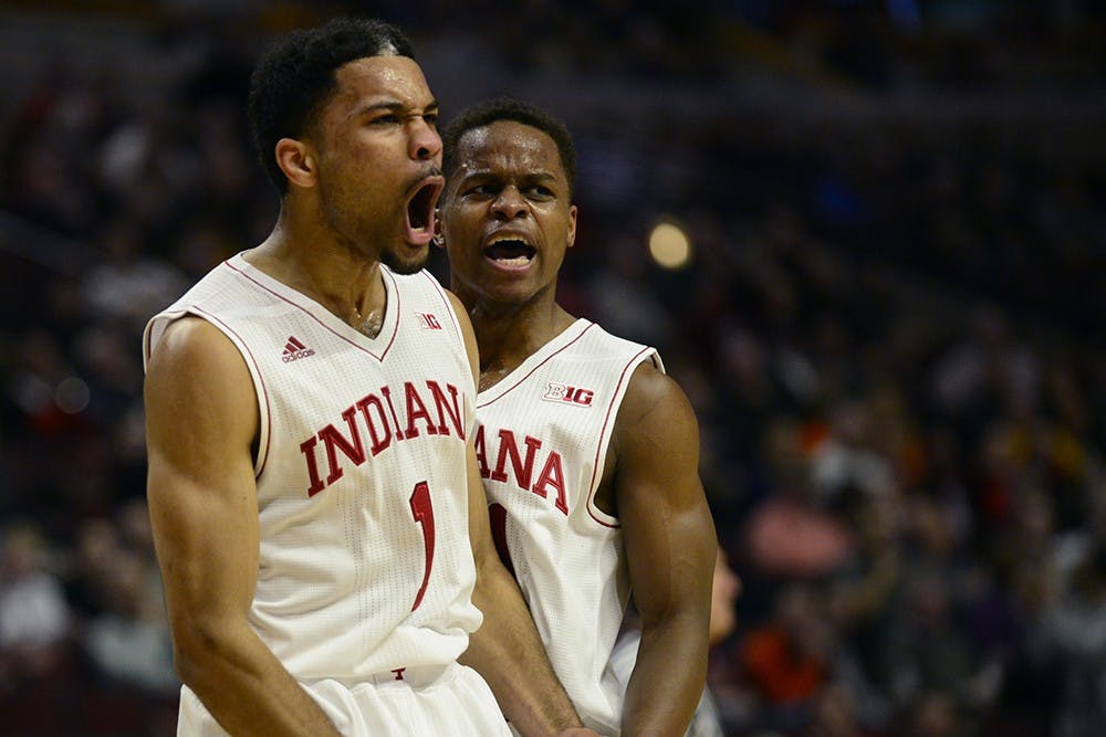 Freshman guard James Blackmon Jr. and junior guard Yogi Ferrell celebrate during IU's game against Northwestern on Thursday at the United Center in Chicago, Ill. Blackmon Jr. and Ferrell combined for 42 of the Hoosiers' 71 points scored against Northwestern.