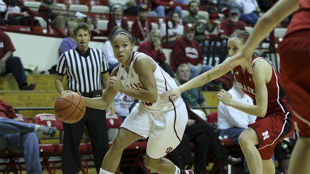 Senior guard Whitney Lindsay runs with the ball during Sunday's win against Nebraska at Assembly Hall.