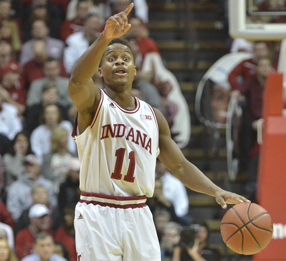 Senior guard Yogi Ferrell shouts out a play during the game against Iowa Thursday at Assembly Hall. The Hoosiers won 85-78.
